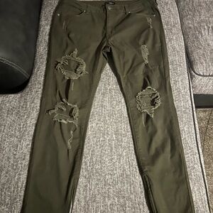 Distressed olive green jeans